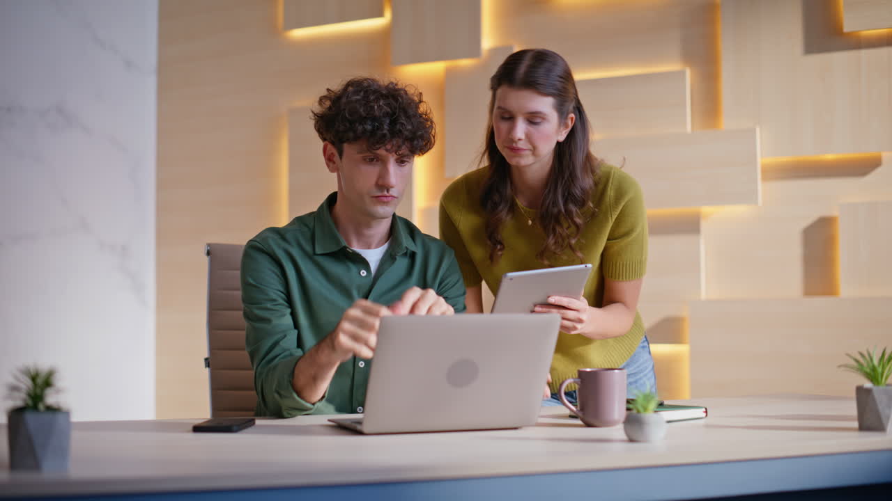 Colleagues collaborating in the office