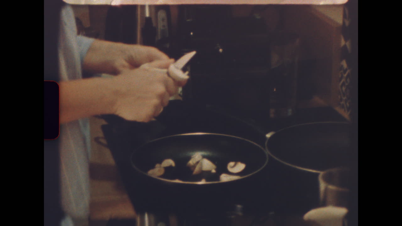 Woman cooking mushrooms in cozy wooden kitchen on vintage film