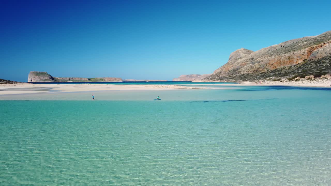 Beautiful white sand beach with turquoise water. Sunny summer day. Paradise. Crete, Greece