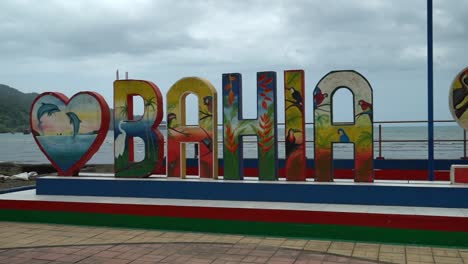 Panning-shot-of-Bahia-Solano-sign,-Colombia