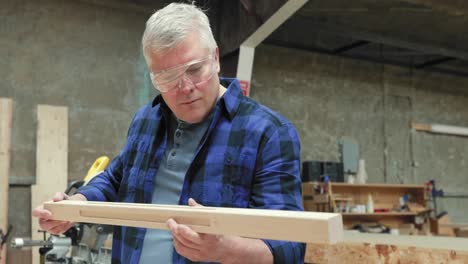 carpenter at work in woodshop