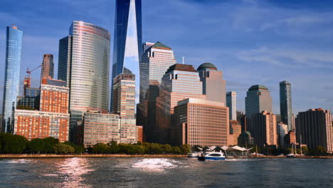 fantastic buildings at the waterfront of the river. boat moves along the riverside. river tour by new york, usa