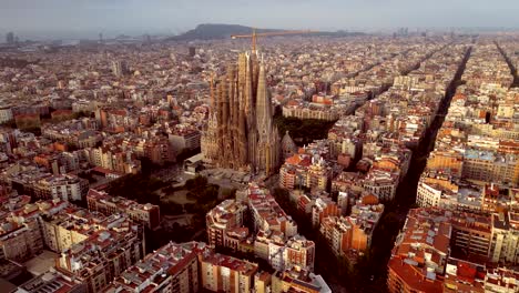 a cinematic aerial drone shot of la sagrada familia with nativity facade