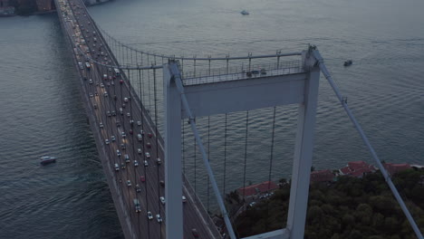 Bridge-with-Car-traffic-in-Sunset,-Aerial-tilt-down-to-Birds-Eye-Overhead-Top-Down-View