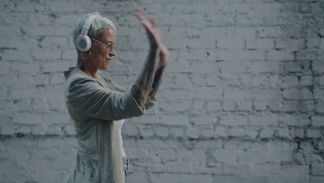 stylish woman dancing to music