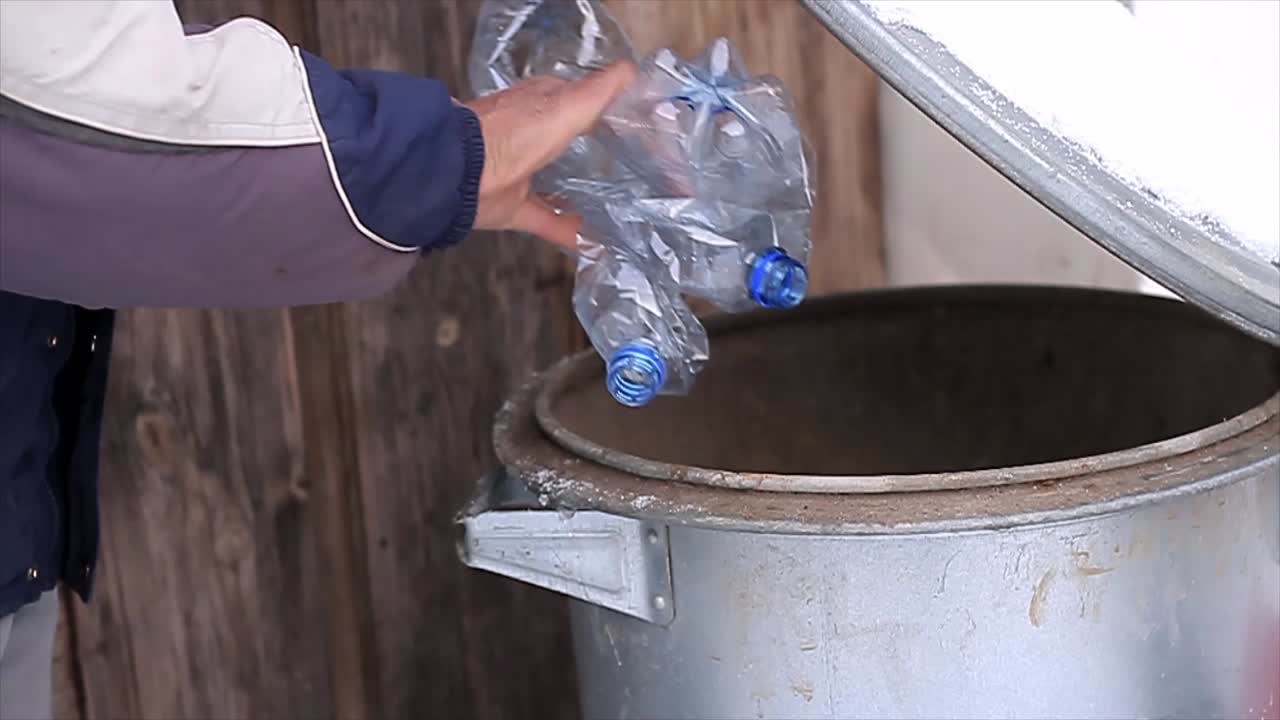 man recycling plastic bottles being environmentally friendly stock video stock footage