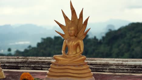 small buddha statue at temple, thailand