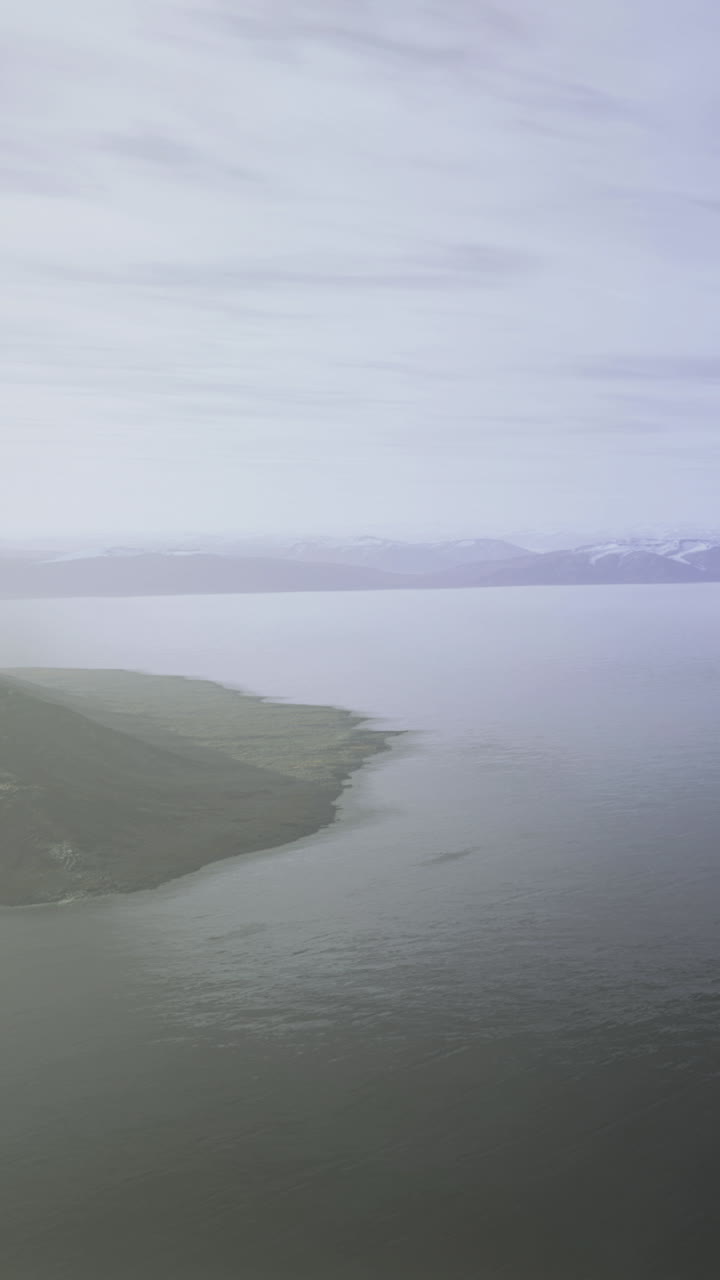 View of the coastline and mountains during cloudy weather