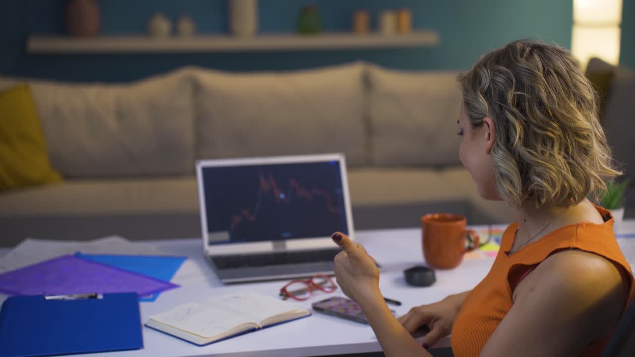The woman analyzing the commercial chart is happy.