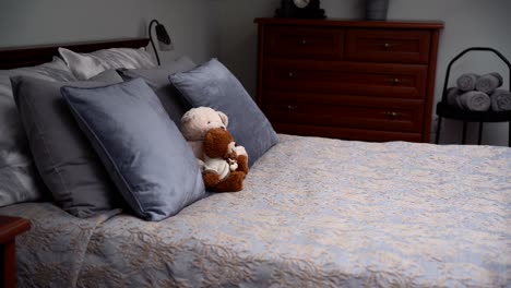 luxury bedroom with toys on the bed