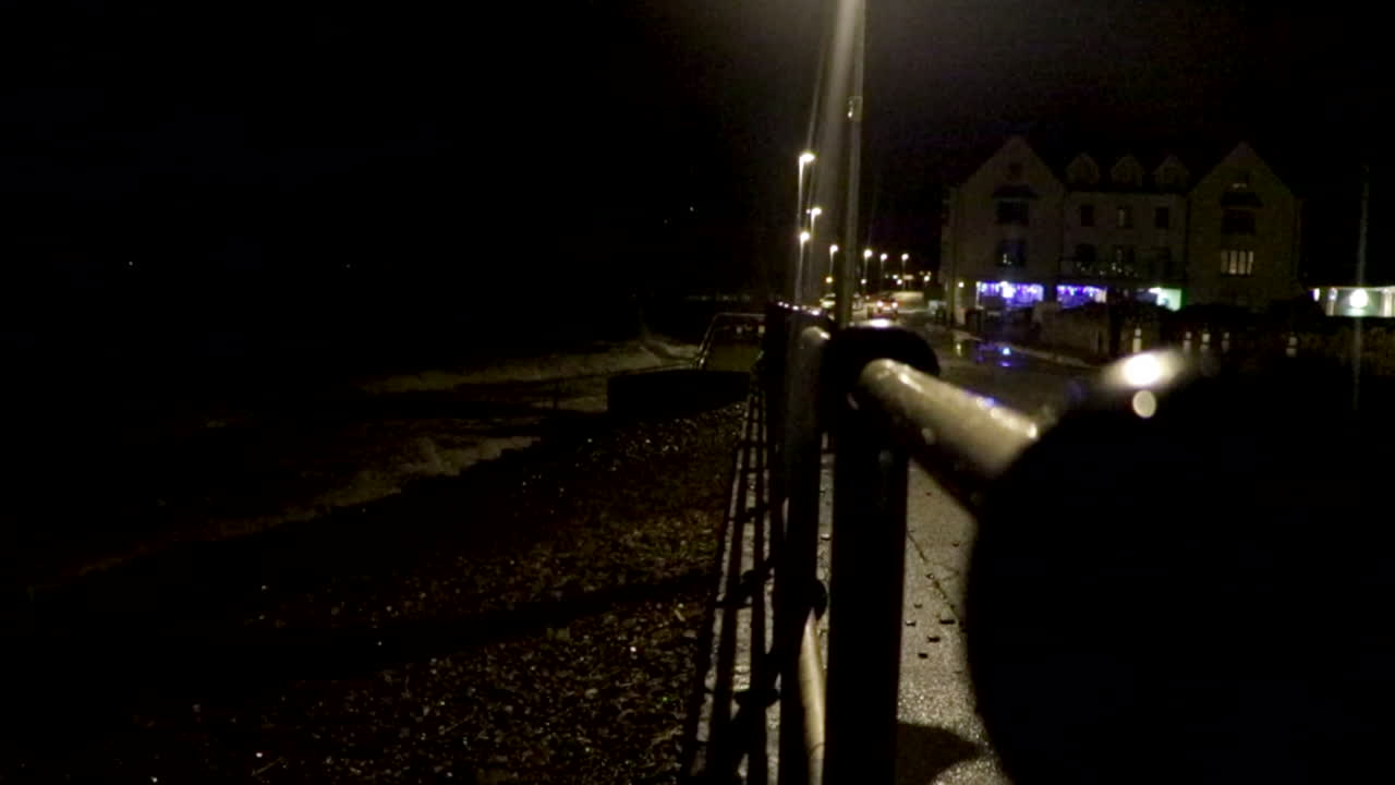 Car Damaged by Storm Waves at Night