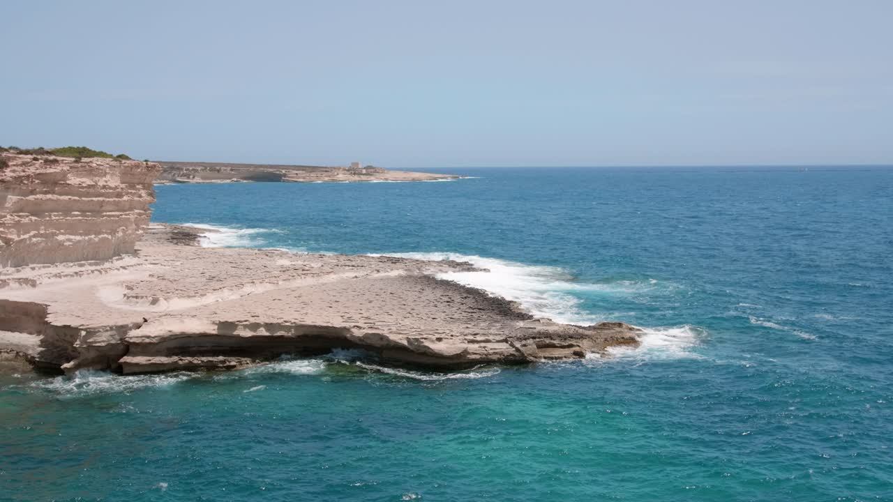 View of ocean waves splash against rocks background, Malta coast