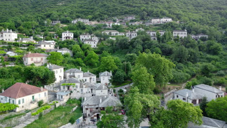 aerial panoramic view over the picturesque village papigo in epirus, greece at sunset