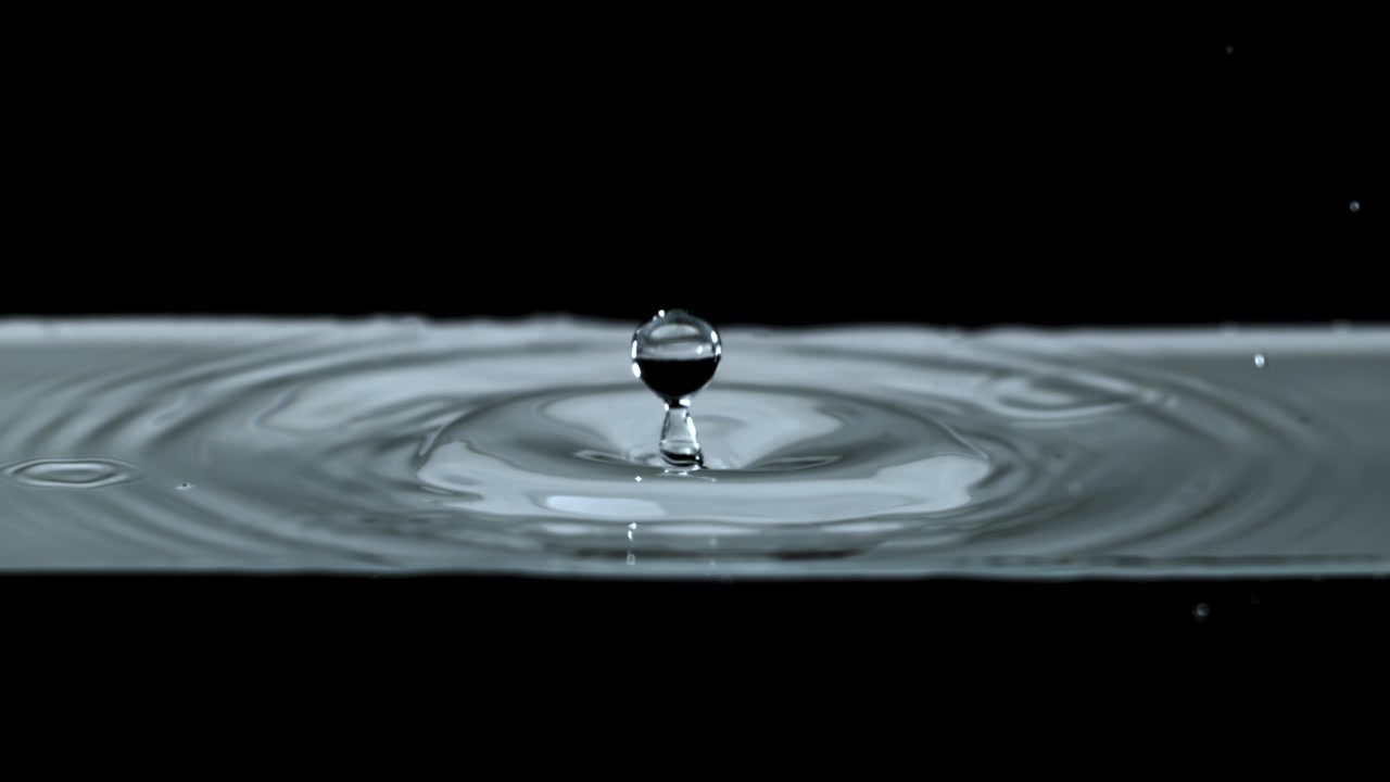 Slow Motion Water Droplet Splashing on Liquid Surface