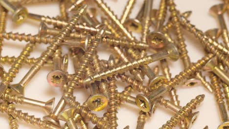 macro shot of selftapping screws in a furniture workshop use of fasteners when working with wood macro shot of selftapping screws in a furniture workshop the use of fasteners when working with wood and plasterboard slow motion