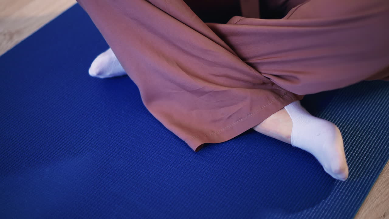 Calm Walking Practice, Mindful Strolling Across Shaded Indoor Flooring, Deliberate Foot Movements In Tranquil Studio Setting, Focused Walking Along Softly Shadowed Mat With Careful Steps Indoors