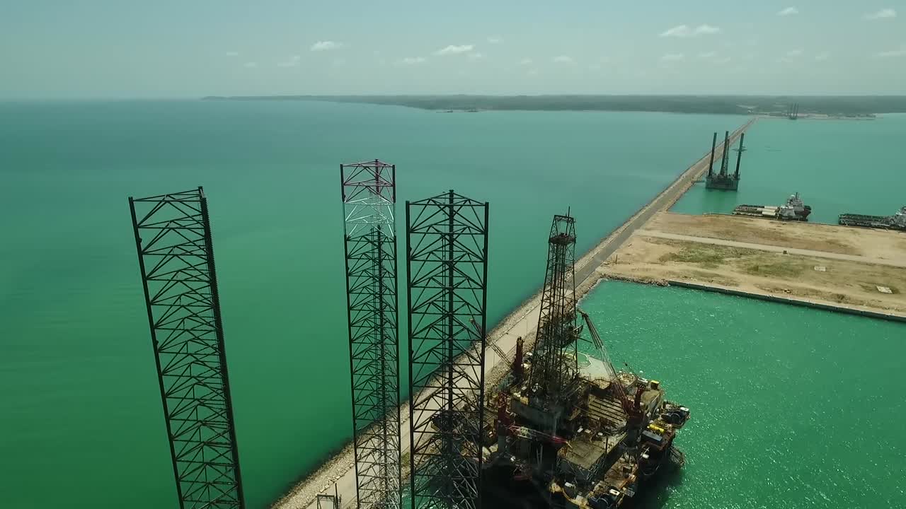 Aerial view of an offshore drilling rig near the ocean in Mexico