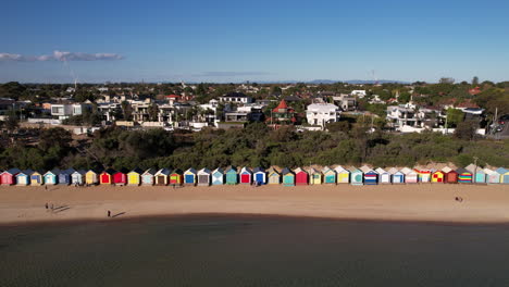 Aerial-View-of-Brighton-Bathing-Boxes,-Tourist-Attraction-and-Landmark-on-Dendy-Street-Beach,-Melbourne,-Australia