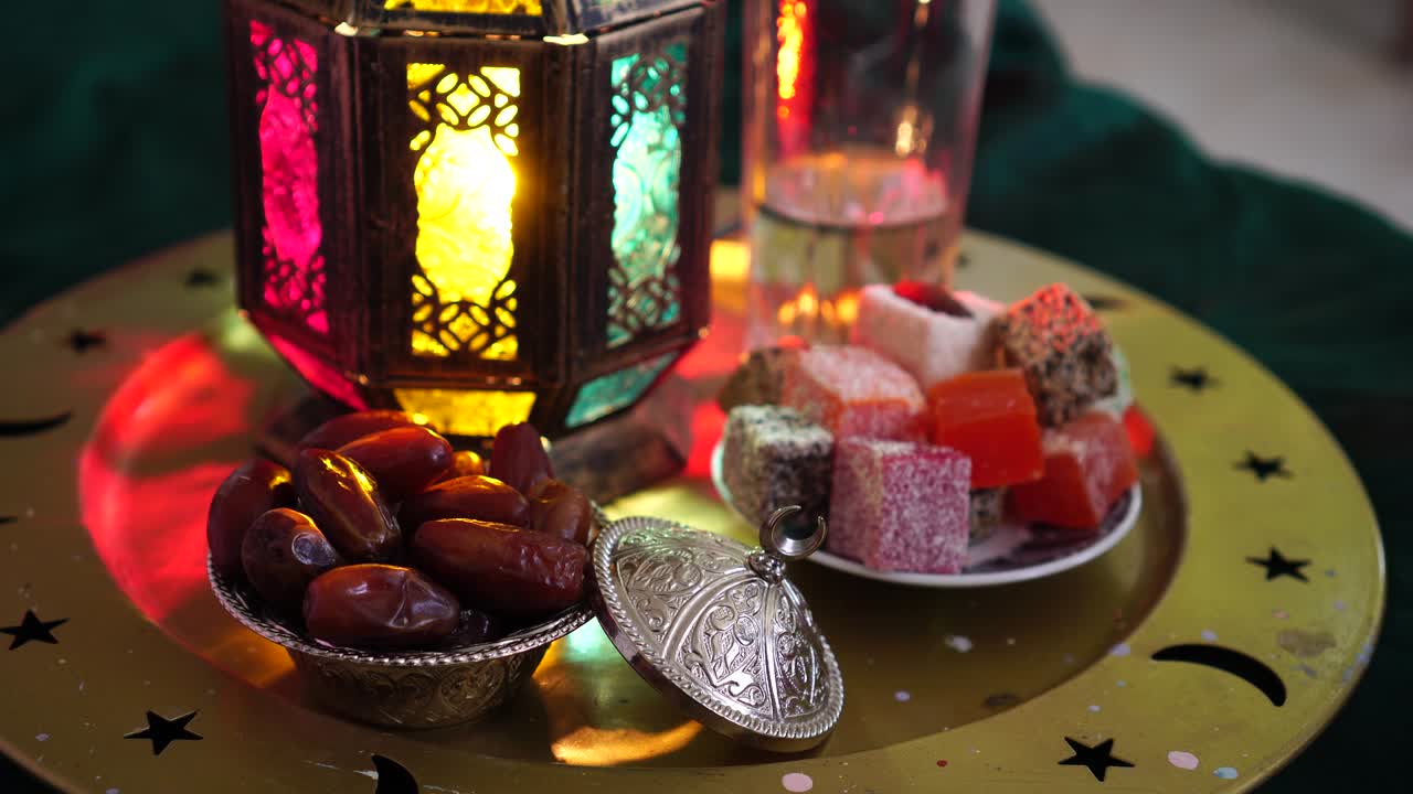 Evening meal during the Holy Muslim month of Ramadan. Dates, water, sweets and dried fruits. The Religion Of Islam