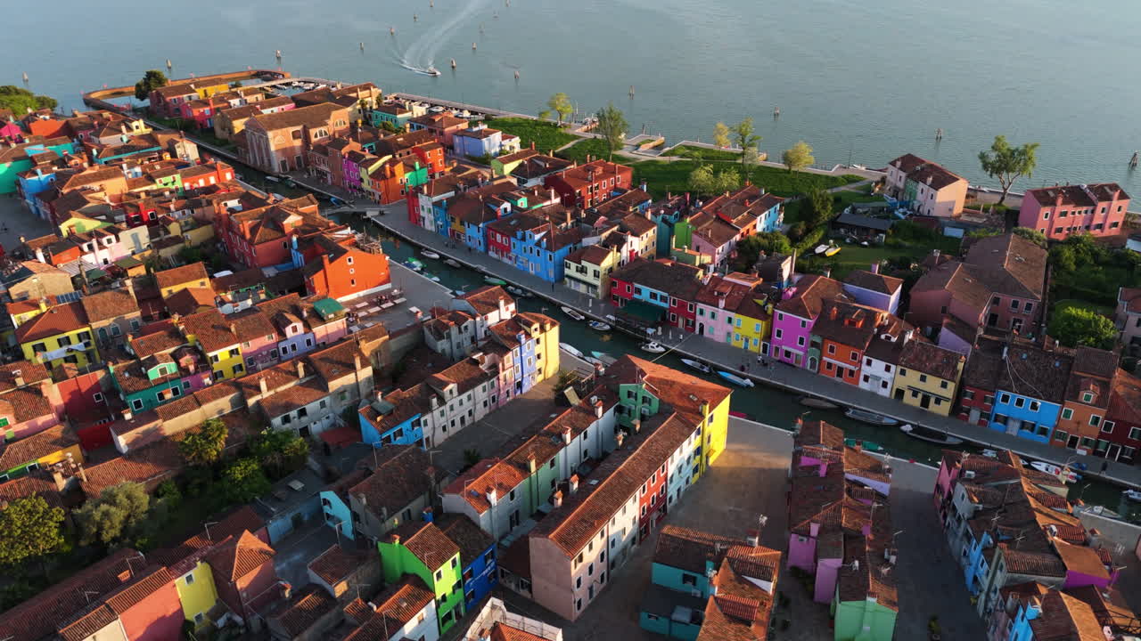 Brightly Colored Buildings Of Burano Island At Sunset Near Venice, Italy. Aerial Drone Shot