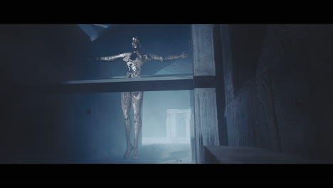 suspended figure in a ruined structure