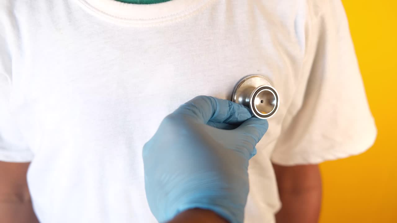 Doctor examining a child's heart with a stethoscope