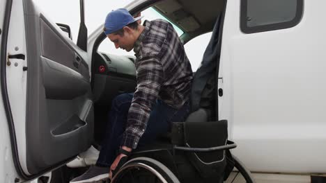 disabled man with wheelchair getting out his car