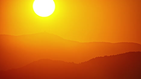 beautiful sunset timelapse over mount olympus in the background along yellow sky during evening time