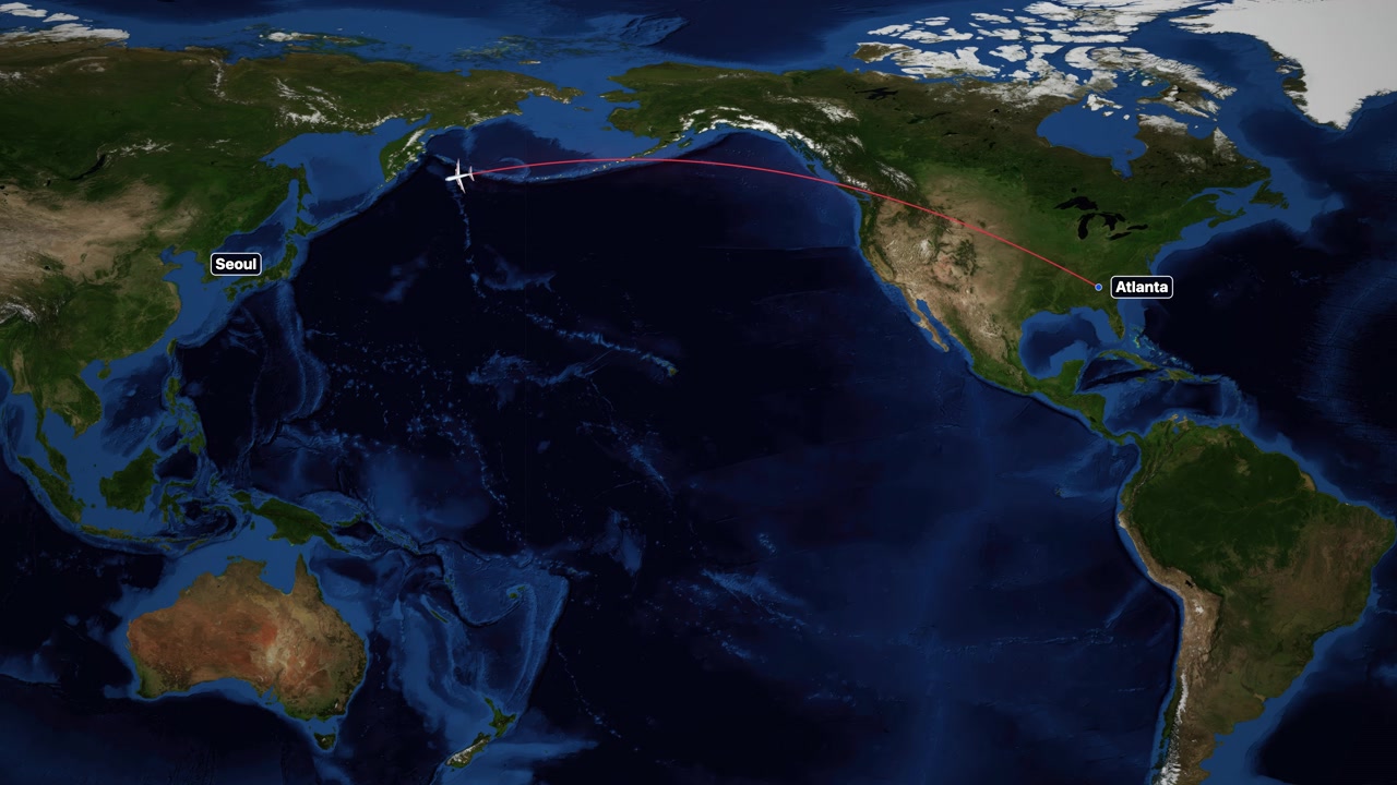 Satellite world map animation follows airplane icon flying from Atlanta to Seoul across Pacific