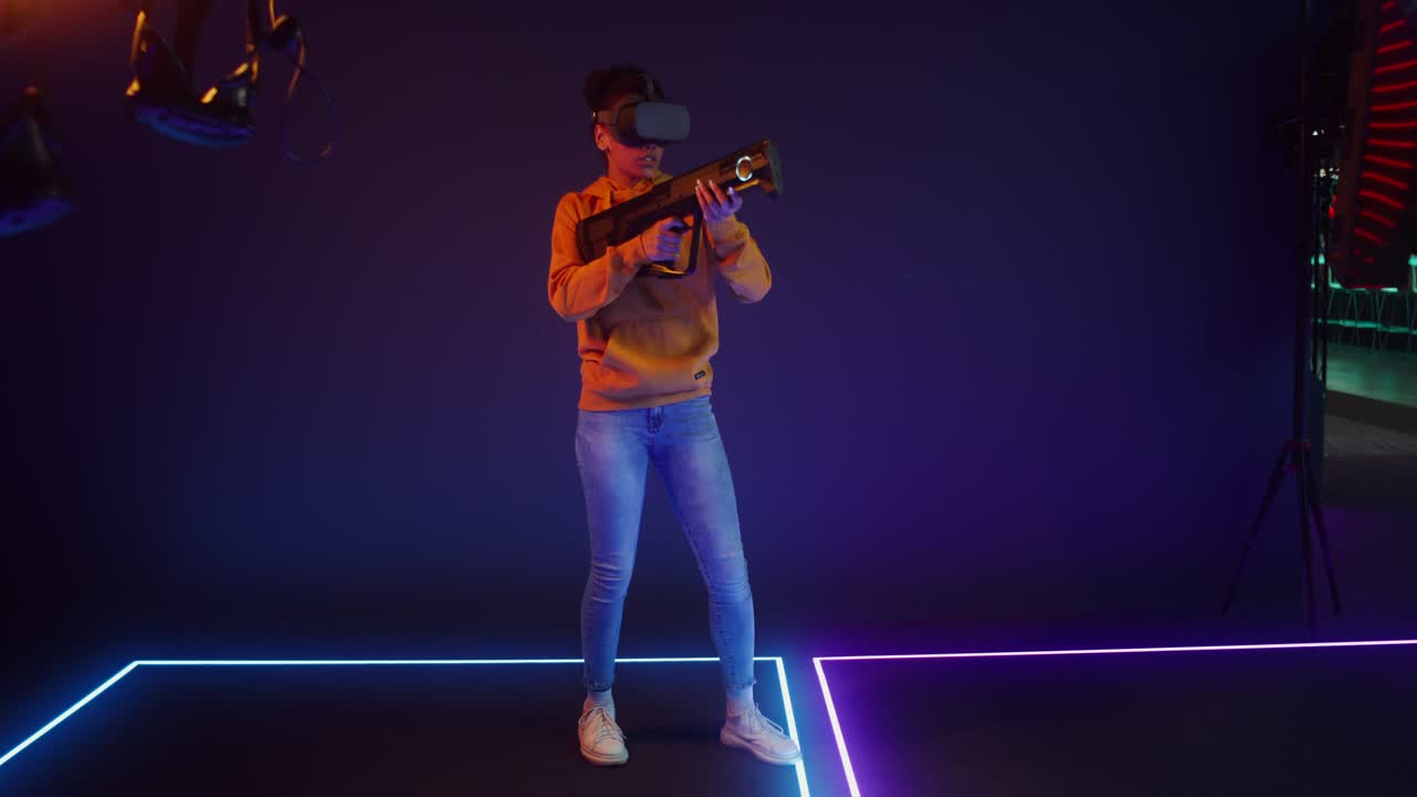 Woman playing a VR game with a gun