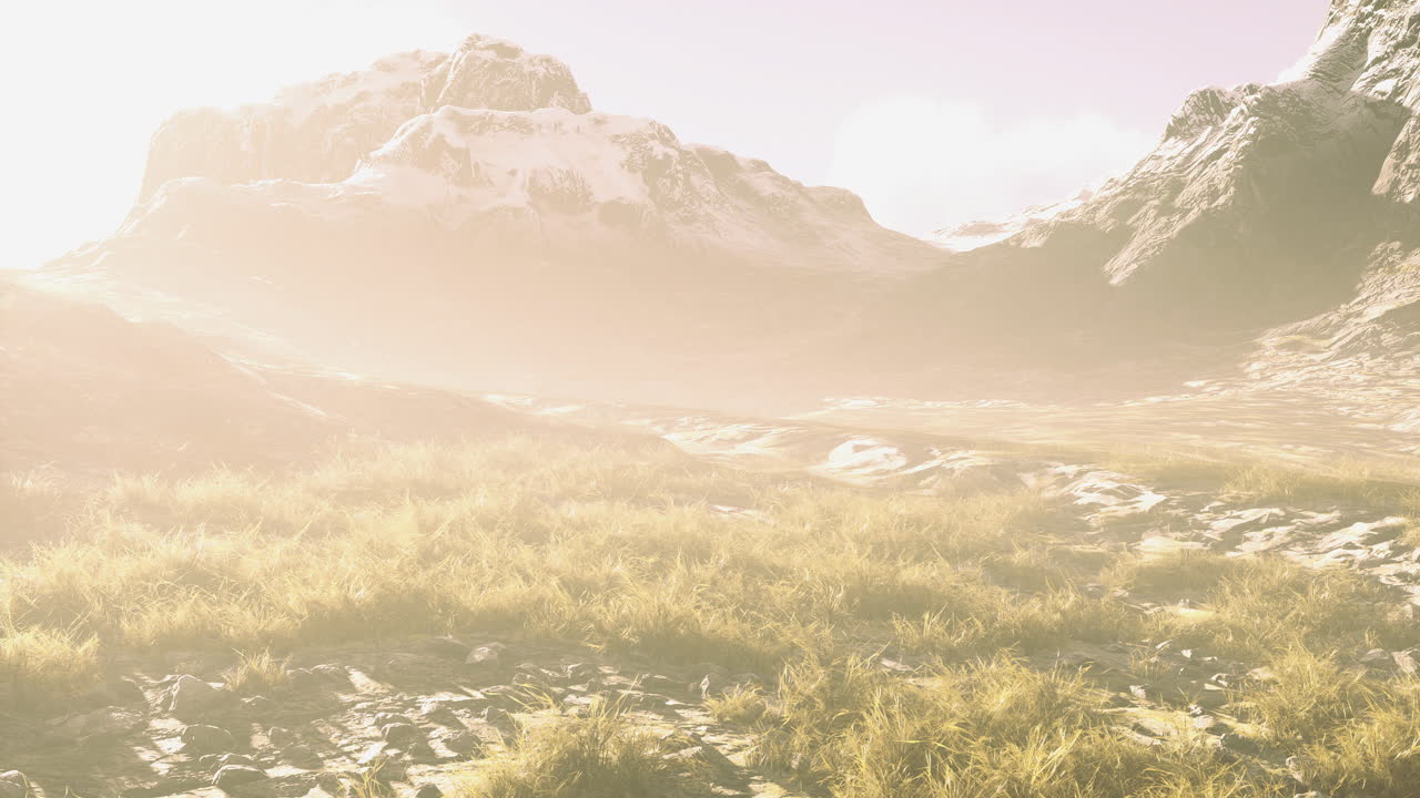 Mountains glow in the soft light of a serene morning landscape