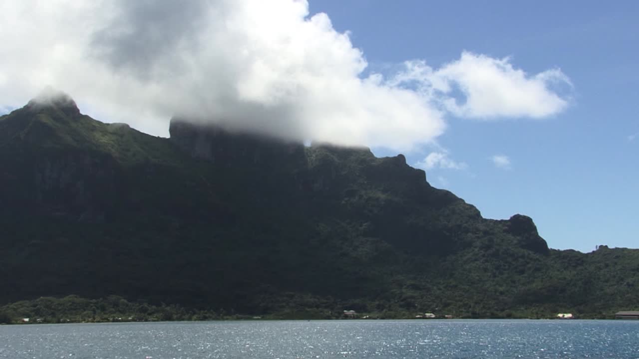 Peak of mount Otemanu covered by the clouds in Bora Bora, French Polynesia.
