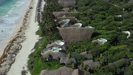 aerial top-down orbiting over papaya playa project luxury resort, tulum