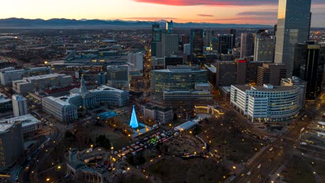 incredible aerial timelapse shot of civic center park during christmas in denver during a sunset