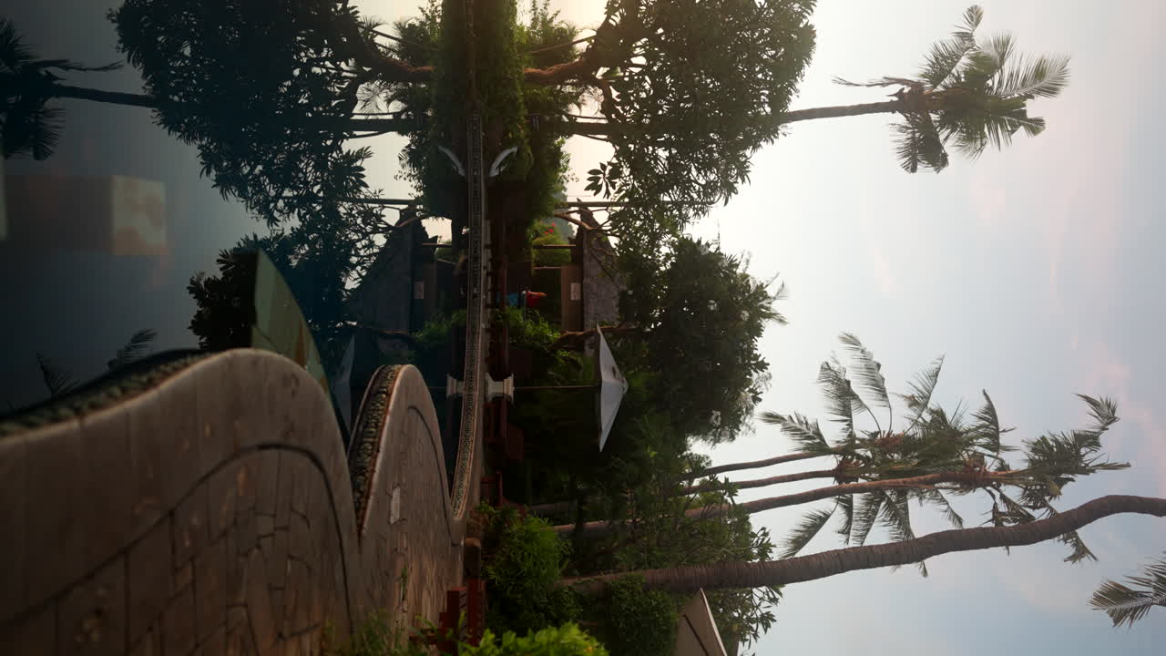 Vertical View Of A Luxury Hotel Swimming Pool During Sunset At Amed In Bali, Indonesia. Static Shot