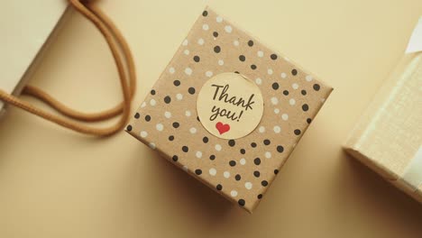 small gift box with "thank you" tag
