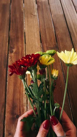 colorful flowers bouquet on a wooden table