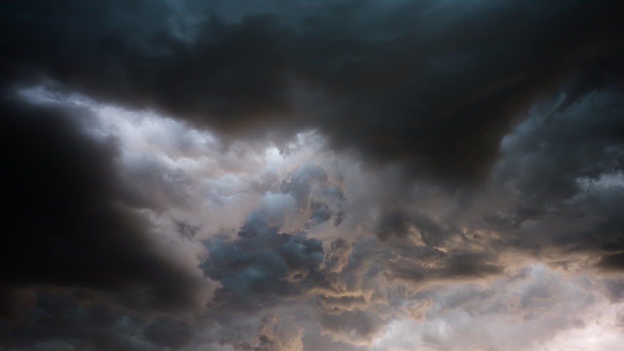 Looking Up Into Powerful Spinning Storm Clouds With Flashing Lightning