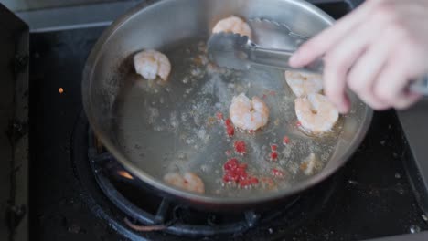 cooking shrimp in a pan