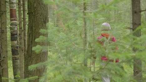 woman hiking through a forest