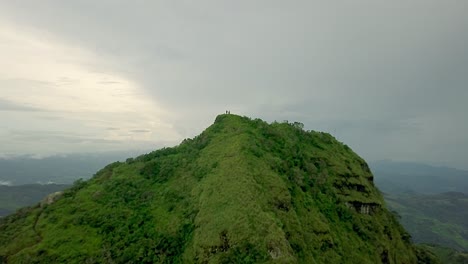 hikers on mountain peak overlook of picacho, panama, epic aerial view