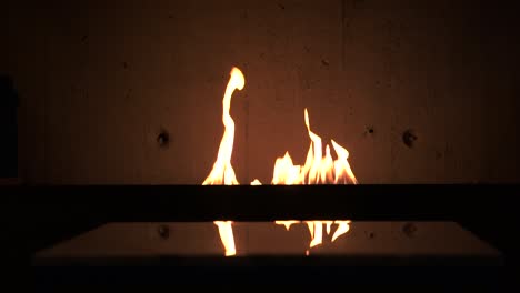 Different-angles-of-artificial-fire-burning-giving-a-modern,-rusty,-ambiental-vibe