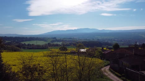 Scenic-view-of-Salvassola-Vic-near-Barcelona,-showcasing-spring-colors-and-a-clear-sky