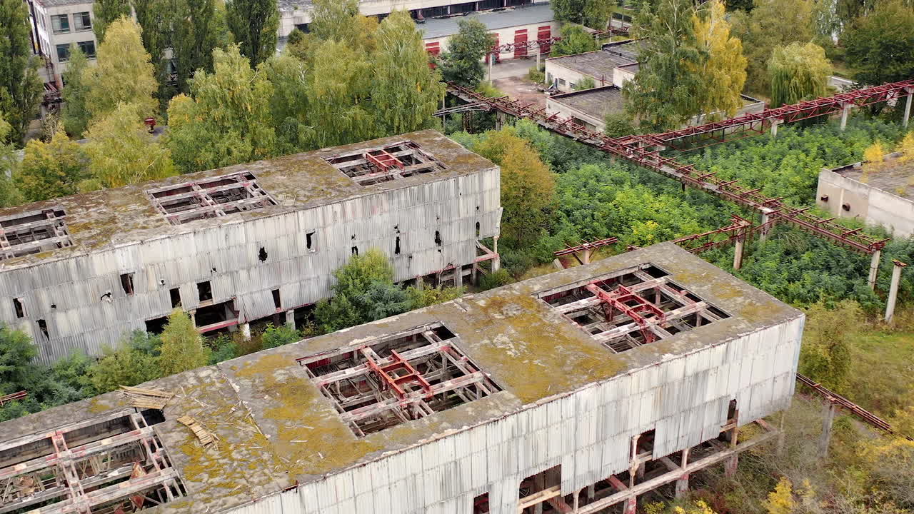 Aerial view of destructive abandoned architecture. Factory destroyed empty buildings.