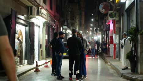 Loads of people on the street on a warm spring night