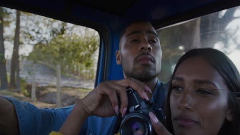 Young-couple-on-a-road-trip-in-their-pick-up-truck