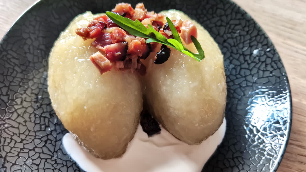 Cepelinai national dish of Lithuania, potato dumplings stuffed with a savory filling