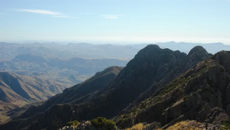 People-standing-on-top-of-the-Four-peak,-in-Mazatzal-Mountains,-AZ---Aerial-view