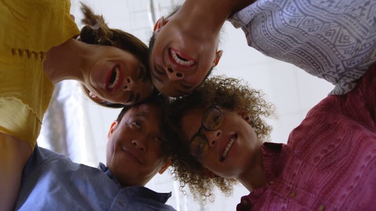 Happy multi-ethnic business colleagues forming huddles in modern office 4k