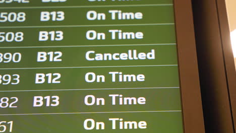 On-Time-And-Cancelled-Flight-Display-On-Departure-Board-In-The-Airport